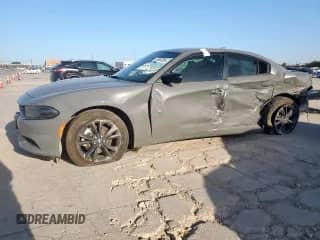 2023 Dodge Charger SXT with VIN 2C3CDXJG0PH676433, listed as a Copart auction lot 66963385 with 34,570 mi miles and Salvage title. Bid and sale history available at DreamBid. Image 1.