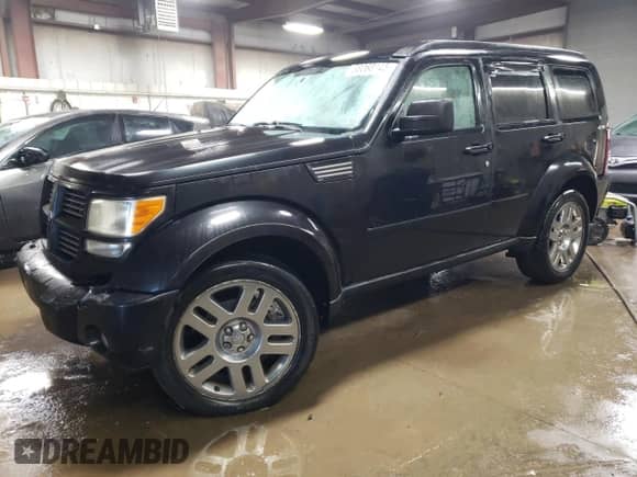 2010 Dodge Nitro Heat with VIN 1D4PU4GK3AW174955, listed as a Copart auction lot 88068145 with 140,824 mi miles and Salvage title. Bid and sale history available at DreamBid. Image 1.