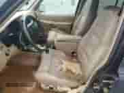 1999 Ford Explorer XLT with VIN 1FMDU34EXXZB35517, listed as a Copart auction lot 64431625 with 111,443 mi miles and Salvage title. Bid and sale history available at DreamBid. Image 7.