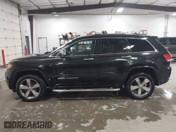 2015 Jeep Grand Cherokee Overland z VIN 1C4RJFCG0FC754152, wystawiony jako IAAI lot #43387900 z przebiegiem 170 600 mil mil oraz . Historia ofert i sprzedaży dostępna na DreamBid. Obrazek 14.