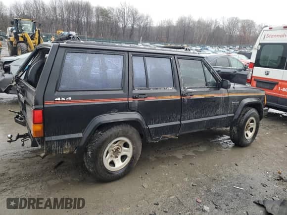 1991 Jeep Grand Cherokee with VIN 1J4FJ88S2ML622450, listed as a Copart auction lot 87998895 with 231,092 mi miles and Salvage title. Bid and sale history available at DreamBid. Image 3.