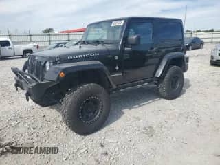 2014 Jeep Wrangler Rubicon with VIN 1C4HJWCG2EL150578, listed as a Copart auction lot 69991225 with 91,221 mi miles and Salvage title. Bid and sale history available at DreamBid. Image 1.