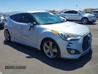 2013 Hyundai Veloster Turbo с VIN KMHTC6AE0DU177983, выставлен на аукционе IAAI как лот 42292102 с пробегом 121 142 миль миль и . История ставок и продаж доступна на DreamBid. Изображение 1.