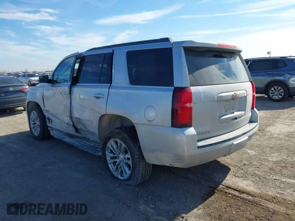 2020 Chevrolet Tahoe LT with VIN 1GNSCBKC5LR226822, listed as a IAAI auction lot 41334853 with 77,091 mi miles and . Bid and sale history available at DreamBid. Image 3.