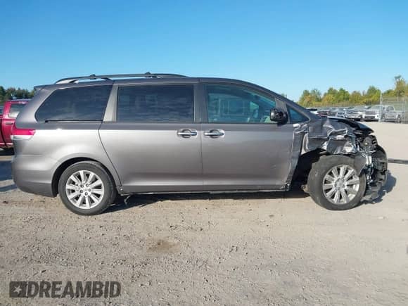 2012 Toyota Sienna XLE with VIN 5TDDK3DC5CS030615, listed as a IAAI auction lot 43358740 with 151,165 mi miles and . Bid and sale history available at DreamBid. Image 14.