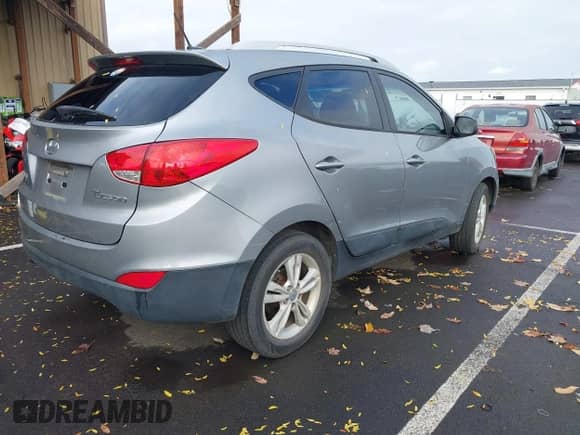 2011 Hyundai Tucson Limited with VIN KM8JU3AC2BU261768, listed as a IAAI auction lot 43496596 with 103,096 mi miles and . Bid and sale history available at DreamBid. Image 4.