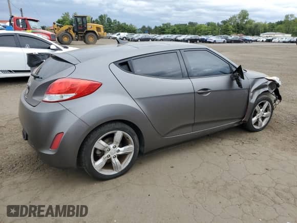 2014 Hyundai Veloster z VIN KMHTC6AD0EU196106, wystawiony jako Copart lot #69494305 z przebiegiem 102 472 mil mil oraz Szkoda całkowita • Salvage title. Historia ofert i sprzedaży dostępna na DreamBid. Obrazek 3.