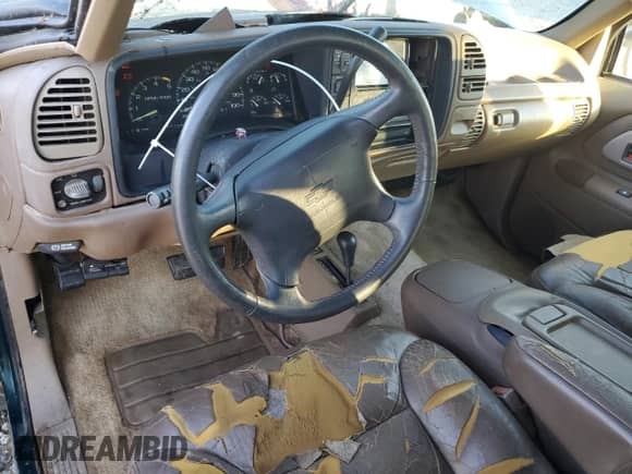1995 Chevrolet Tahoe with VIN 3GNEK18K7SG119164, listed as a Copart auction lot 77744684 with 165,798 mi miles and Salvage title. Bid and sale history available at DreamBid. Image 8.