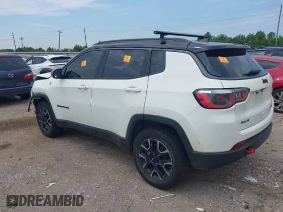 2019 Jeep Compass Trailhawk with VIN 3C4NJDDB5KT766401, listed as a IAAI auction lot 43050485 with 58,564 mi miles and . Bid and sale history available at DreamBid. Image 3.