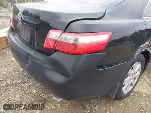 2007 Toyota Camry LE z VIN 4T1BK46K17U520161, wystawiony jako IAAI lot #43452382 z przebiegiem 167 917 mil mil oraz . Historia ofert i sprzedaży dostępna na DreamBid. Obrazek 12.
