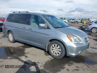 2008 Honda Odyssey EX-L with VIN 5FNRL38628B104477, listed as a IAAI auction lot 43363199 with 220,595 mi miles and . Bid and sale history available at DreamBid. Image 1.