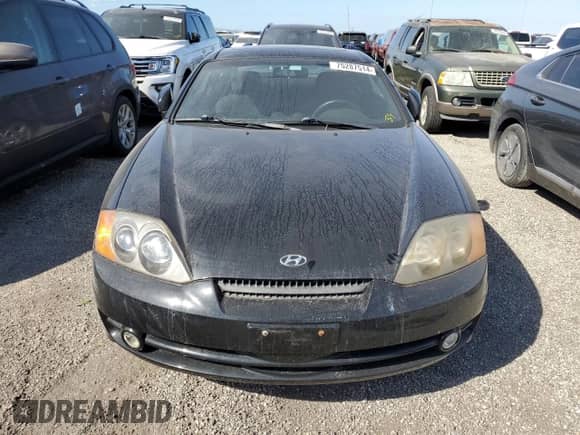 2004 Hyundai Tiburon GT with VIN KMHHN65F54U133867, listed as a Copart auction lot 75287514 with Not provided miles and Salvage title. Bid and sale history available at DreamBid. Image 5.