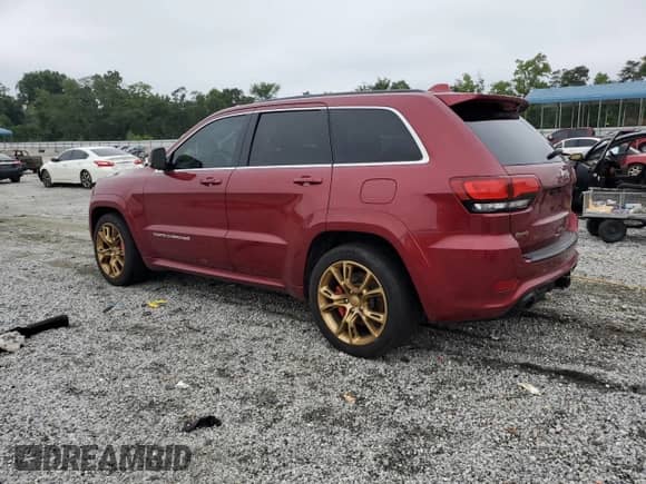 2014 Jeep Grand Cherokee SRT-8 with VIN 1C4RJFDJ2EC382063, listed as a Copart auction lot 69380995 with 174,198 mi miles and Clean title. Bid and sale history available at DreamBid. Image 2.