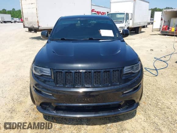 2014 Jeep Grand Cherokee SRT-8 z VIN 1C4RJFDJ7EC527372, wystawiony jako IAAI lot #41889040 z przebiegiem 120 015 mil mil oraz . Historia ofert i sprzedaży dostępna na DreamBid. Obrazek 12.