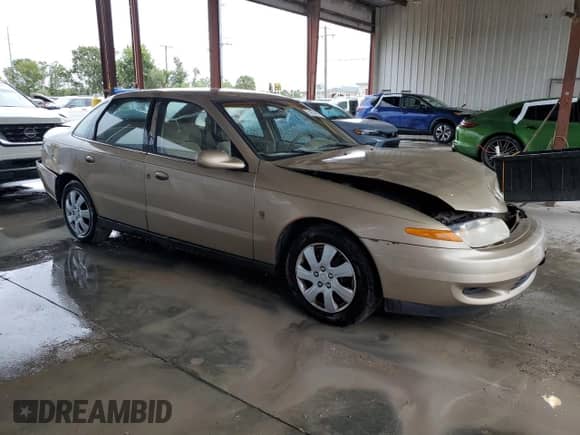 2001 Saturn LS with VIN 1G8JU52F71Y556133, listed as a Copart auction lot 74704314 with 199,915 mi miles and Salvage title. Bid and sale history available at DreamBid. Image 4.