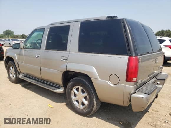 2000 Cadillac Escalade with VIN 1GYEK63R9YR197300, listed as a Copart auction lot 60026815 with 303,297 mi miles and Salvage title. Bid and sale history available at DreamBid. Image 2.