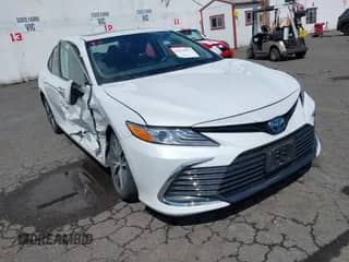 2023 Toyota Camry Hybrid XLE with VIN 4T1F31AK6PU615593, listed as a IAAI auction lot 42131977 with 11,300 mi miles and . Bid and sale history available at DreamBid. Image 1.