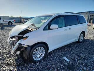 2013 Toyota Sienna XLE AAS with VIN 5TDYK3DC8DS332113, listed as a Copart auction lot 69010115 with 148,685 mi miles and Salvage title. Bid and sale history available at DreamBid. Image 1.