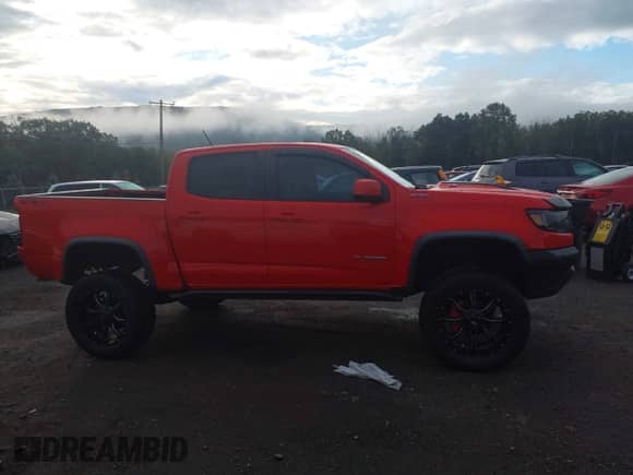 2018 Chevrolet Colorado 4WD ZR2 z VIN 1GCGTEEN2J1208397, wystawiony jako IAAI lot #43252268 z przebiegiem 76 787 mil mil oraz . Historia ofert i sprzedaży dostępna na DreamBid. Obrazek 13.