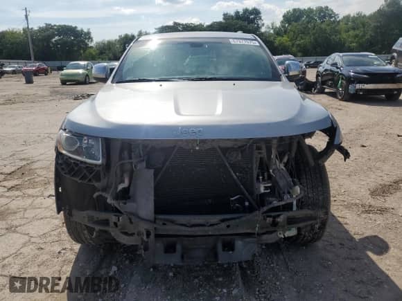2014 Jeep Grand Cherokee Laredo with VIN 1C4RJEAGXEC573989, listed as a Copart auction lot 67977075 with 141,134 mi miles and Salvage title. Bid and sale history available at DreamBid. Image 5.