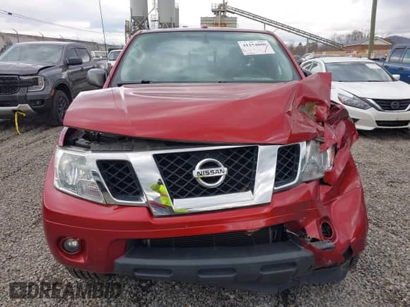 2018 Nissan Frontier SV z VIN 1N6DD0CW3JN727009, wystawiony jako IAAI lot #41154800 z przebiegiem 55 837 mil mil oraz . Historia ofert i sprzedaży dostępna na DreamBid. Obrazek 12.