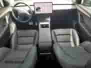 2023 Tesla Model Y Performance z VIN 7SAYGDEF0PF958265, wystawiony jako Copart lot #65881755 z przebiegiem 9 581 mil mil oraz Szkoda całkowita • Salvage title. Historia ofert i sprzedaży dostępna na DreamBid. Obrazek 8.