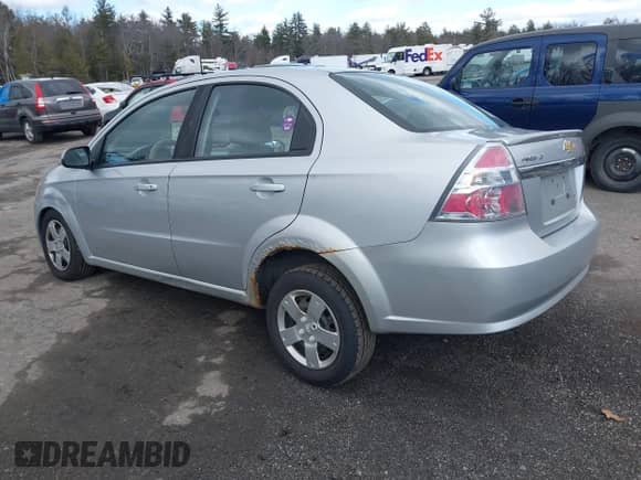 2011 Chevrolet Aveo 1LT with VIN KL1TD5DE6BB215854, listed as a IAAI auction lot 41681408 with 141,848 mi miles and . Bid and sale history available at DreamBid. Image 3.