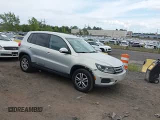 2013 Volkswagen Tiguan S with VIN WVGBV3AXXDW580007, listed as a IAAI auction lot 43104824 with 203,479 mi miles and . Bid and sale history available at DreamBid. Image 1.