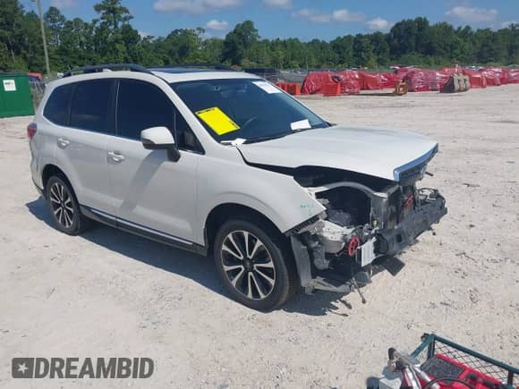 2017 Subaru Forester Touring z VIN JF2SJGWC6HH434017, wystawiony jako IAAI lot #42676511 z przebiegiem 110 981 mil mil oraz . Historia ofert i sprzedaży dostępna na DreamBid. Obrazek 1.