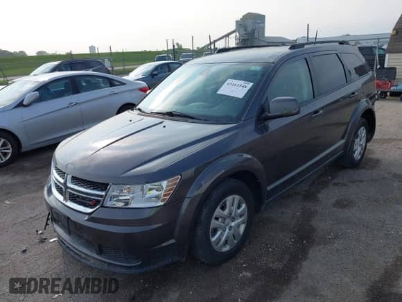2020 Dodge Journey SE Value with VIN 3C4PDCAB2LT275333, listed as a IAAI auction lot 43161548 with 56,931 mi miles and . Bid and sale history available at DreamBid. Image 2.