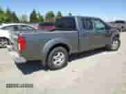 2007 Nissan Frontier SE z VIN 1N6AD09U57C463966, wystawiony jako Copart lot #65341765 z przebiegiem 169 134 mil mil oraz Szkoda całkowita • Salvage title. Historia ofert i sprzedaży dostępna na DreamBid. Obrazek 3.