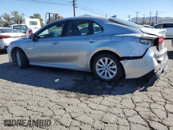 2019 Toyota Camry LE с VIN 4T1B11HKXKU821888, выставлен на аукционе Copart как лот 86159375 с пробегом 64 469 миль миль и Списание • Salvage title. История ставок и продаж доступна на DreamBid. Изображение 2.