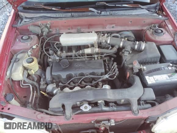 1997 Hyundai Accent GL z VIN KMHVF24N5VU369924, wystawiony jako Copart lot #85036114 z przebiegiem 168 797 mil mil oraz Szkoda całkowita • Salvage title. Historia ofert i sprzedaży dostępna na DreamBid. Obrazek 11.