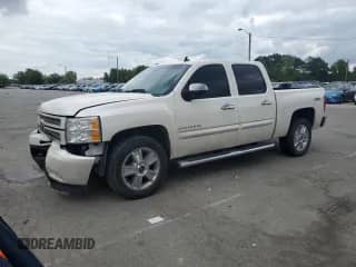 2012 Chevrolet Silverado 1500 LTZ with VIN 3GCPKTE74CG263740, listed as a Copart auction lot 70085095 with 180,351 mi miles and Salvage title. Bid and sale history available at DreamBid. Image 1.