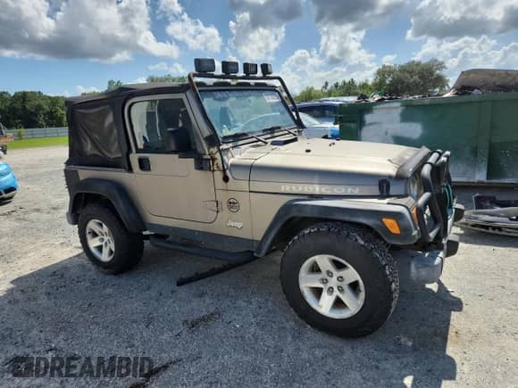 2003 Jeep Wrangler Rubicon с VIN 1J4FA69S13P310131, выставлен на аукционе Copart как лот 59139025 с пробегом 260 349 миль миль и Списание • Salvage title. История ставок и продаж доступна на DreamBid. Изображение 4.
