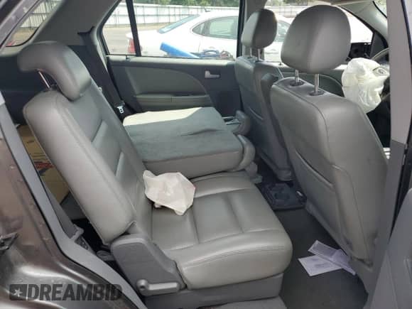 2005 Ford Freestyle SEL с VIN 1FMZK02105GA32268, выставлен на аукционе Copart как лот 63659795 с пробегом Не указан миль и Списание • Salvage title. История ставок и продаж доступна на DreamBid. Изображение 11.