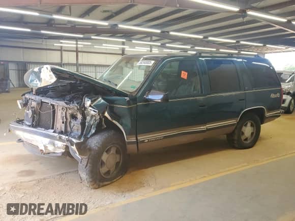 1998 Chevrolet Tahoe z VIN 1GNEK13R4WJ334882, wystawiony jako Copart lot #58240005 z przebiegiem 202 983 mil mil oraz Szkoda całkowita • Salvage title. Historia ofert i sprzedaży dostępna na DreamBid. Obrazek 1.