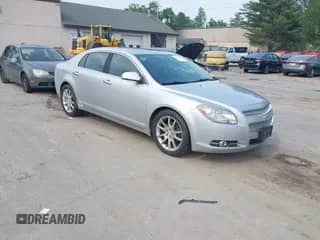 2012 Chevrolet Malibu LTZ z VIN 1G1ZG5E72CF255927, wystawiony jako IAAI lot #42441174 z przebiegiem 134 665 mil mil oraz . Historia ofert i sprzedaży dostępna na DreamBid. Obrazek 1.