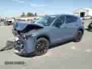 2024 Mazda CX-5 S Carbon Edition z VIN JM3KFBCM0R0369883, wystawiony jako Copart lot #67634595 z przebiegiem 25 085 mil mil oraz Szkoda całkowita • Salvage title. Historia ofert i sprzedaży dostępna na DreamBid. Obrazek 1.