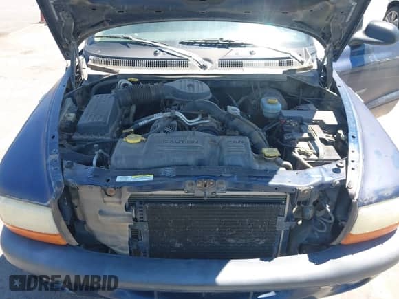 2002 Dodge Dakota Sport z VIN 1B7HL38X12S700825, wystawiony jako IAAI lot #42881583 z przebiegiem 199 484 mil mil oraz . Historia ofert i sprzedaży dostępna na DreamBid. Obrazek 10.