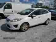 2012 Ford Fiesta SE with VIN 3FADP4BJ0CM218571, listed as a Copart auction lot 82151155 with 174,595 mi miles and Clean title. Bid and sale history available at DreamBid. Image 1.