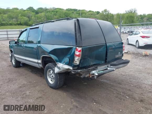 1995 Chevrolet Suburban with VIN 1GNEC16K3SJ381424, listed as a IAAI auction lot 42300584 with 128,745 mi miles and . Bid and sale history available at DreamBid. Image 3.