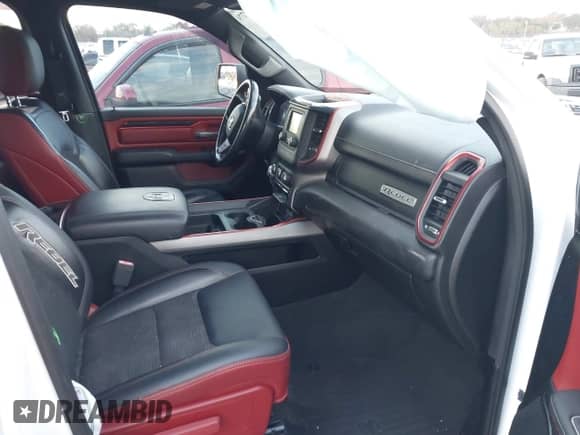 2019 Ram 1500 Rebel with VIN 1C6SRFET2KN860824, listed as a IAAI auction lot 41284779 with 105,715 mi miles and . Bid and sale history available at DreamBid. Image 5.