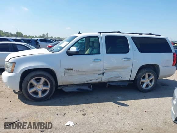 2011 Chevrolet Suburban LT with VIN 1GNSCJE02BR187519, listed as a IAAI auction lot 43136755 with 203,141 mi miles and . Bid and sale history available at DreamBid. Image 13.