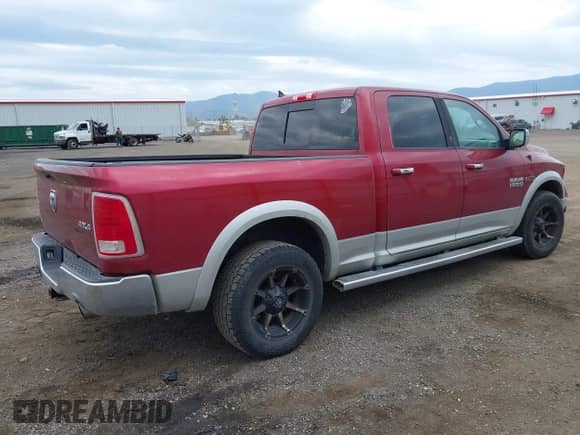 2014 Ram 1500 Laramie z VIN 1C6RR7VM5ES297951, wystawiony jako IAAI lot #42361374 z przebiegiem 210 193 mil mil oraz . Historia ofert i sprzedaży dostępna na DreamBid. Obrazek 4.