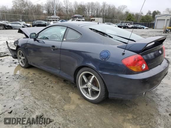 2004 Hyundai Tiburon GT с VIN KMHHN65F34U127906, выставлен на аукционе Copart как лот 85219724 с пробегом 98 585 миль миль и Чистый • Clean title. История ставок и продаж доступна на DreamBid. Изображение 2.