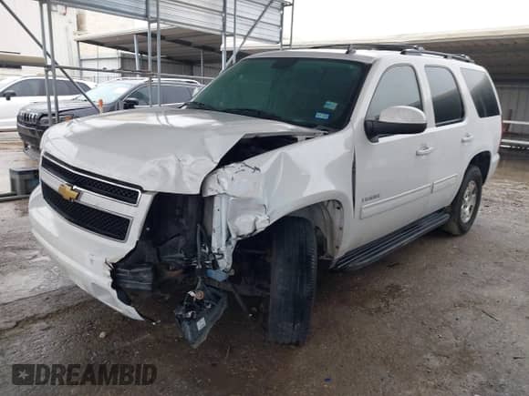 2013 Chevrolet Tahoe LS with VIN 1GNSCAE05DR276326, listed as a IAAI auction lot 41894489 with 173,183 mi miles and . Bid and sale history available at DreamBid. Image 2.