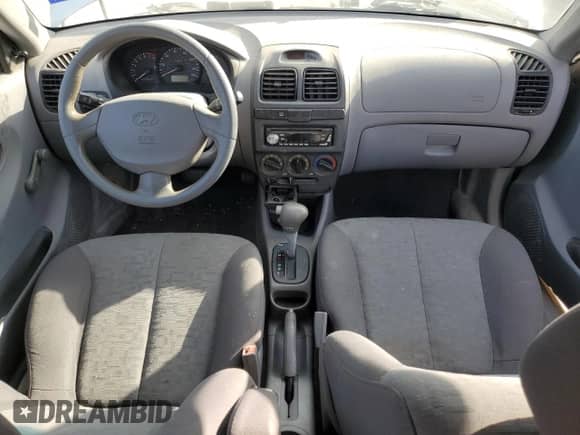 2004 Hyundai Accent GL с VIN KMHCG35C94U292013, выставлен на аукционе Copart как лот 84253364 с пробегом Не указан миль и Списание • Salvage title. История ставок и продаж доступна на DreamBid. Изображение 8.