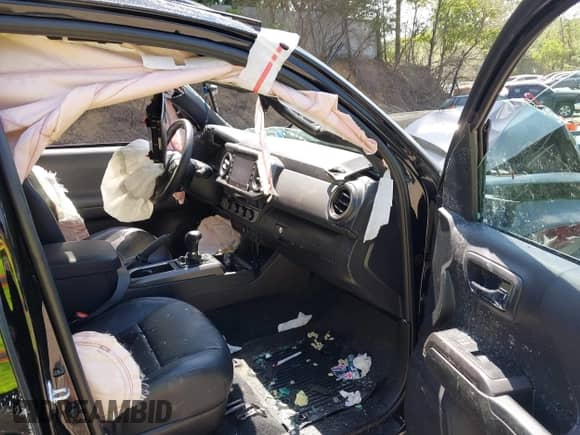 2021 Toyota Tacoma SR5 z VIN 3TYDZ5BN1MT002778, wystawiony jako IAAI lot #42591088 z przebiegiem Nie podano mil oraz . Historia ofert i sprzedaży dostępna na DreamBid. Obrazek 5.