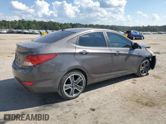 2014 Hyundai Accent GLS z VIN KMHCT4AE8EU704156, wystawiony jako Copart lot #81121835 z przebiegiem 149 131 mil mil oraz Szkoda całkowita • Salvage title. Historia ofert i sprzedaży dostępna na DreamBid. Obrazek 3.